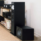 Bowers & Wilkins ASW608 subwoofer, in a room, matte black lifestyle