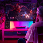 M-Audio BX5 BT active nearfield monitors set up for gaming and mobile use, showcasing sleek black design and front-facing speakers.