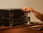 Marantz CD 60 CD player with sleek design and silver finish, featuring front-loading disc tray and control buttons.