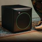 Mackie CR8SBT subwoofer with sleek black enclosure and control panel, designed for professional audio monitoring on a desktop setup.