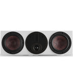 DALI Rubikore Cinema center speaker with high-gloss white finish, showcasing sleek design and front grille for home theater audio.
