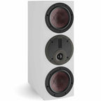 DALI Rubikore Cinema center speaker in high-gloss white, showcasing sleek design and speaker grille for home theater audio.