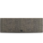 DALI Rubikore Cinema center speaker in natural walnut finish, showcasing sleek design and front grille for home theater audio.