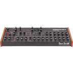 Sequential Prophet Rev2-16 desktop synthesizer with 16-voice polyphony, featuring knobs and controls on the front panel.