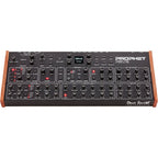 Sequential Prophet Rev2-16 desktop synthesizer with control panel and keyboard interface, showcasing its knobs and digital screen.