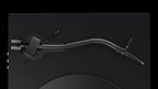 Pro-Ject Debut Pro S turntable with curved tonearm in satin black, viewed from top showing the platter and tonearm layout.