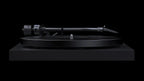 Pro-Ject Debut Pro S turntable in satin black with a sleek design, featuring a tonearm and platter for high-quality vinyl listening.