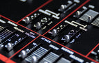 Dtronics DT-800 synthesizer with various knobs and buttons, featuring a sleek black design and detailed control panel.