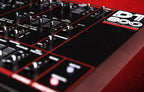 Dtronics DT-800 synthesizer with multiple knobs and sliders, showcasing front panel controls and colorful LED displays.