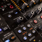Pioneer DJ DJM-V10-LF mixer with multiple effects controls and colorful LED displays for professional DJ performances