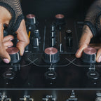 AlphaTheta Euphonia DJ Mixer showing control knobs, faders, and input ports on a sleek professional audio device.