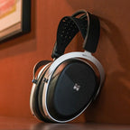 HiFiMAN Audivina LE wired headphones with sleek black design and over-ear cushions for immersive sound experience.