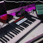 Novation FLkey 2 49 MIDI keyboard with 49 keys, showing its sleek design and control surface in a lifestyle setting.