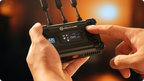 Hollyland Pyro S wireless video receiver connected to a camera, displaying a live video feed in a professional wireless video system setup.