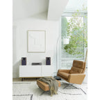 JBL 4305P active bookshelf speakers with black finish and modern design, shown from a slight side angle.