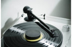 Pro-Ject XA B turntable with wooden plinth and tonearm, close-up view of the high-quality audio equipment.