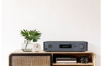 NAD C 379 stereo amplifier with sleek design and control knobs, showcasing high-quality audio equipment.