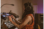 Audeze MM-100 studio headphones with over-ear design, black color, and padded ear cups for professional audio monitoring.