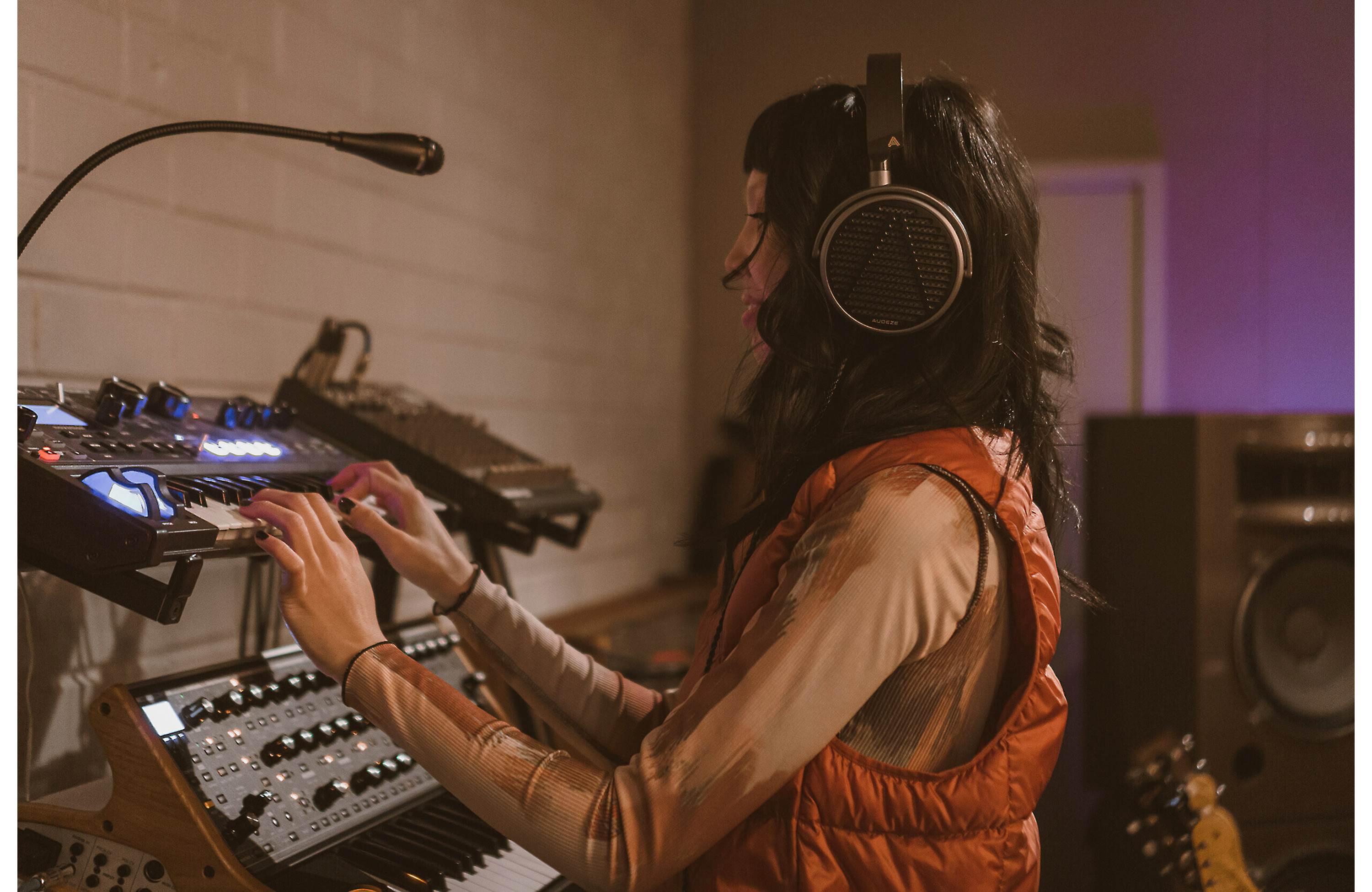 Audeze MM-100 studio headphones with over-ear design, black color, and padded ear cups for professional audio monitoring.