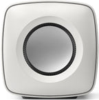 KEF KC62 subwoofer with sleek black enclosure and front-facing port, designed for powerful bass in home audio systems.