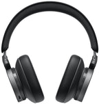 Close-up of Bang & Olufsen Beoplay H95 wireless headphones with cushioned ear cups and sleek black design.