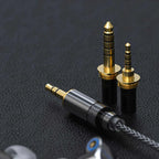 FiiO FA7S in-ear headphones with black and silver design, showcasing the sleek, ergonomic earbud fit and detailed audio drivers.