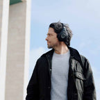 Focal Bathys wireless headphones worn by a man, featuring deep black over-ear design with sleek, modern style.