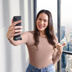 Rode VideoMic ME-C+ in use, compact iOS & Android microphone with built-in controls and Rode branding, capturing audio clearly.