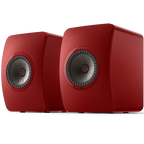 KEF LS50 Wireless II wireless speakers showing sleek black cabinets and modern design with speaker grilles.