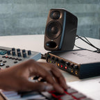 IK Multimedia iLoud Micro Monitor Pro active nearfield monitor speakers with sleek black design and controls visible.