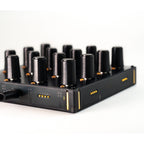 Intech Studio EN16 Detent Series 3 MIDI controller with rotary knobs and control buttons, close-up view.