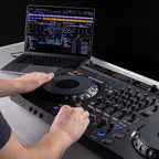 AlphaTheta DDJ-GRV6 DJ controller showing jog wheels, control buttons, and input ports on a sleek black surface.