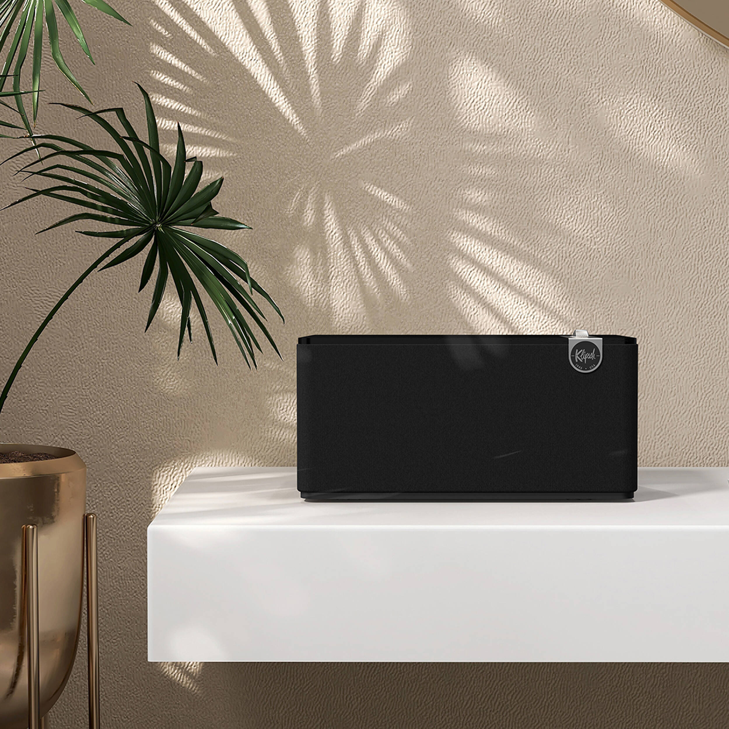 Klipsch The Three Plus wireless speaker, lifestyle on a shelf in black