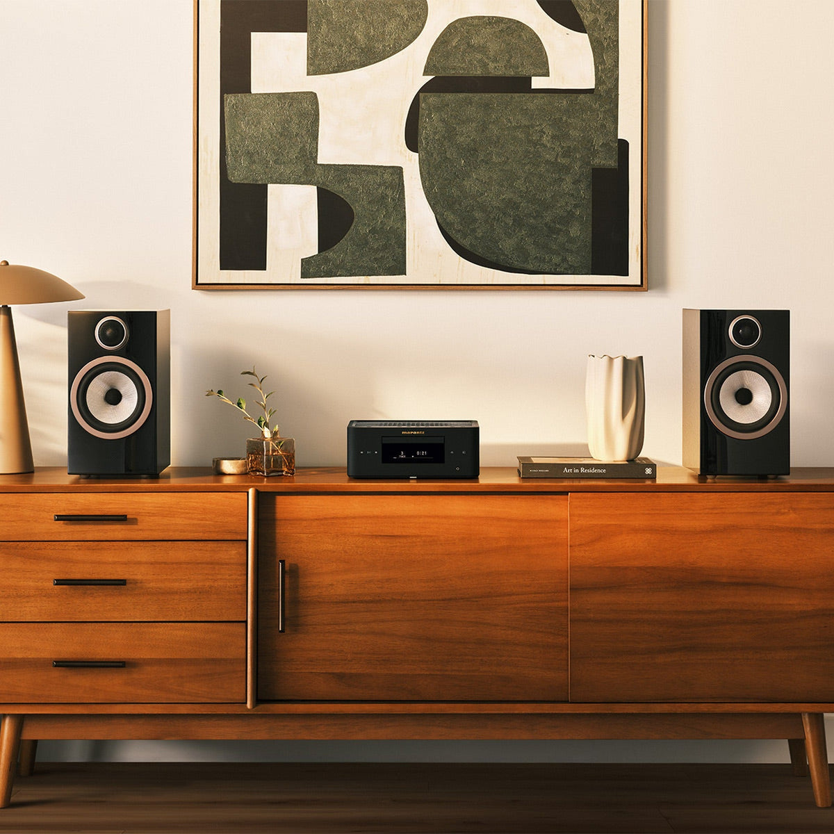 Marantz MCR 60n DAB matte black on a walnut sideboard between bookshelf speakers