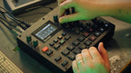 Elektron Syntakt drum machine and sampler with compact electronic interface and colorful knobs and buttons.