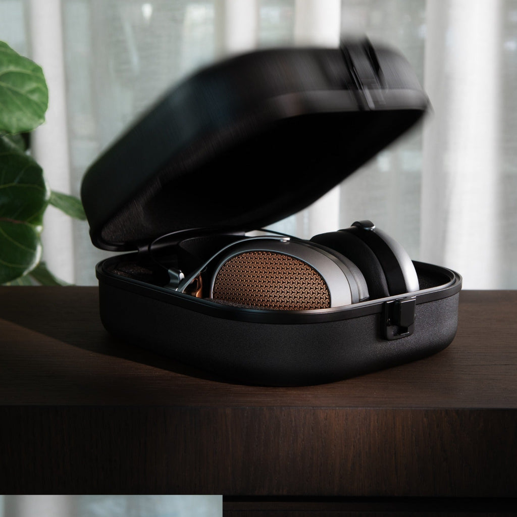 Wired Meze Audio Poet headphones with over-ear design, black cushions, and sleek cables for immersive listening.
