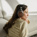 Wired Meze Audio Poet headphones with black ear cups and silver accents, featuring a sleek design and adjustable headband.