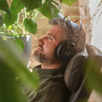 Meze Audio 105 AER wired headphones with sleek design and padded ear cups, shown in a close-up image.