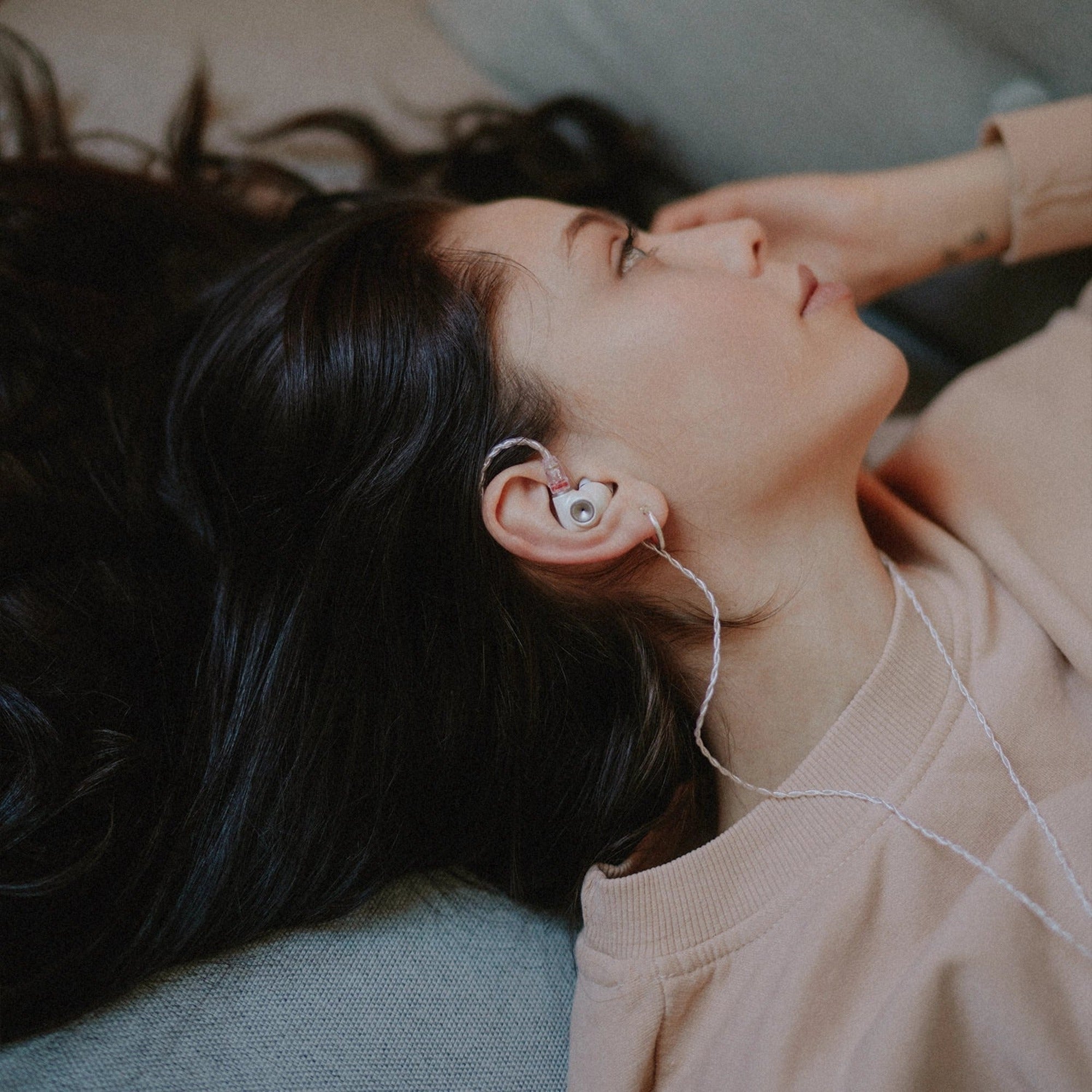 Woman wearing the Meze Audio Alba S in-ear monitors
