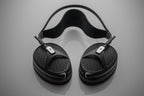 Meze Audio Empyrean II wired headphones with open-back design and luxurious ear cups, showcasing premium craftsmanship and audio quality.