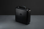 Closed case of Meze Audio Empyrean II wired headphones in a sleek suitcase, showcasing the premium design and high-quality build.