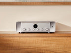 Marantz MODEL 50 stereo amplifier in silver finish, front view showcasing control knobs and display on a studio background.