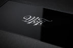 Close-up of MoFi Electronics UltraPhono phono preamp showing input and control knobs on a sleek black device.
