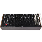 Moog DFAM analog synthesizer with patch points and control knobs, showcasing its compact electronic music instrument.