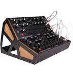 Moog DFAM analog synthesizer with knobs, patch points, and control panel for modular sound creation.