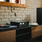 NAD C 3030S stereo amplifier with sleek black design and control knobs, showcasing high-fidelity audio equipment.