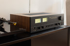 NAD C 3050 stereo amplifier with sleek black design and control knobs, showcasing high-quality audio equipment for home sound systems.