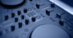 Native Instruments Traktor MX2 DJ controller with dual jog wheels, faders, and control knobs for professional DJ mixing.