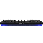Native Instruments Traktor MX2 DJ controller with dual jog wheels, mixer faders, and illuminated controls for DJ mixing.