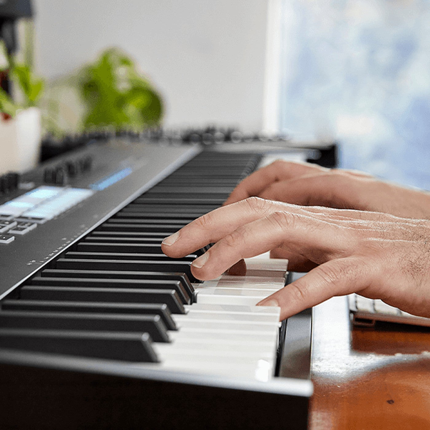 Hands playing the Novation Launchkey 88 MK4 keys